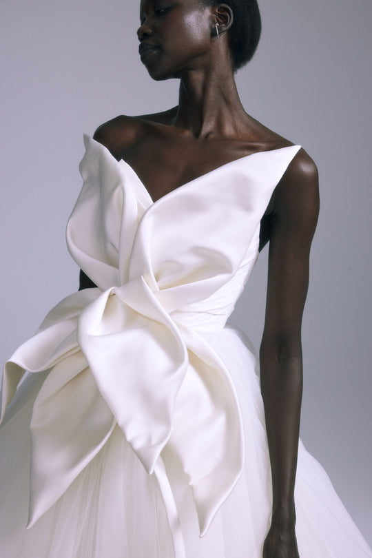 Orchid, $12,000, dress from Collection Bridal by Amsale, Fabric: taffeta
