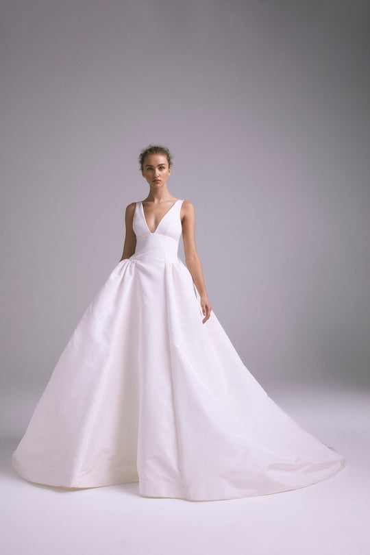 Hendrix, $6,995, dress from Collection Bridal by Amsale, Fabric: faille