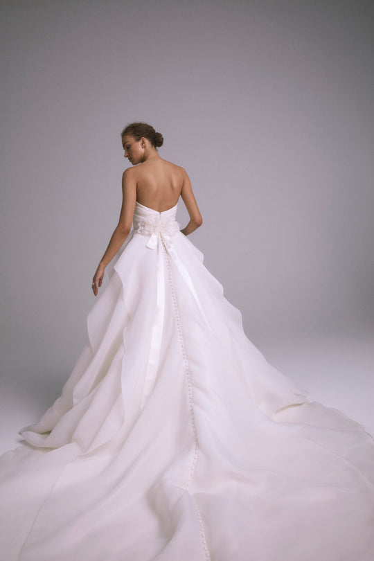 Lotus, $6,995, dress from Collection Bridal by Amsale, Fabric: faille