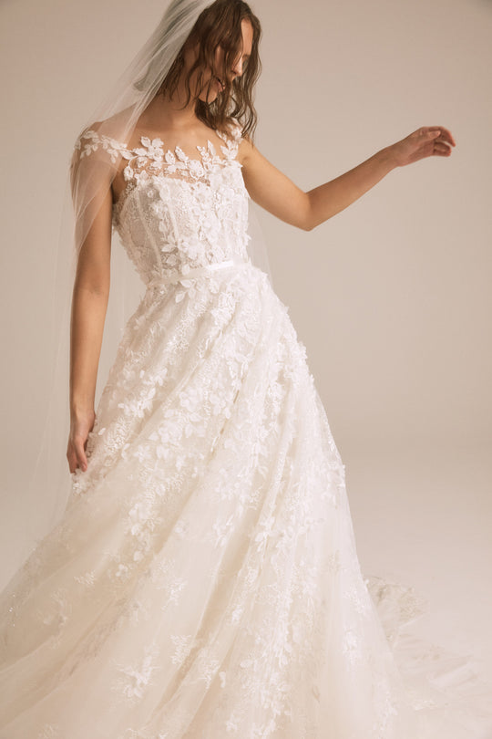Tamia, $4,500, dress from Collection Bridal by Nouvelle Amsale, Fabric: floral