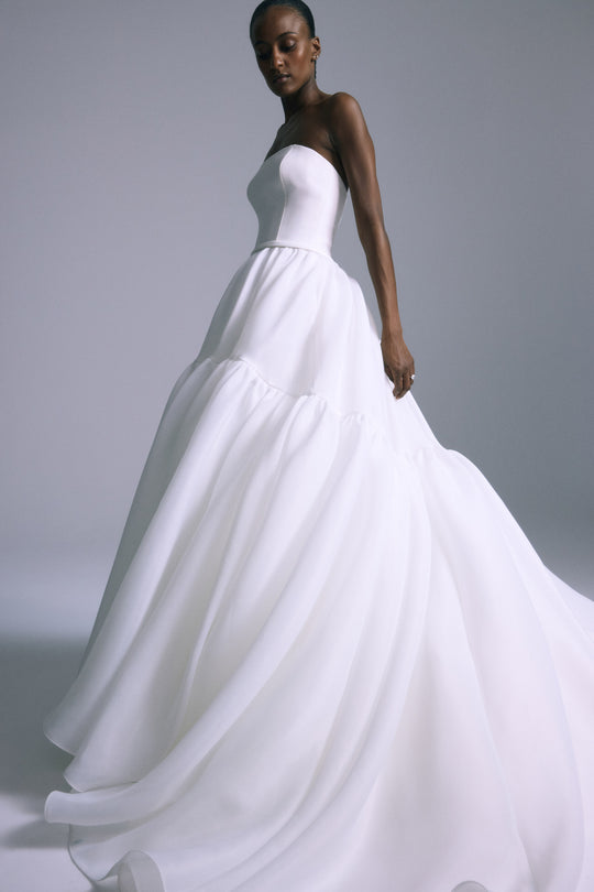 silk gazar wedding dress Draped silk gazar exudes grace for evenings of full moon, denuding the shoulders in a criss-cross neckline. Discover the Bridal SS23 now on zuhairmurad.com Photographed by @sharbelboumansour Makeup by @bassamfattouh Hair by @