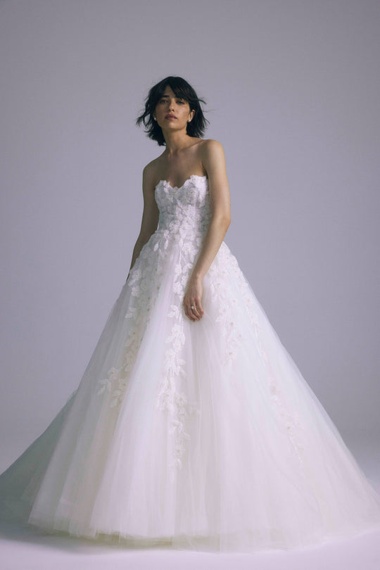 Delia, $7,595, dress from Collection Bridal by Amsale, Fabric: embroidered-tulle