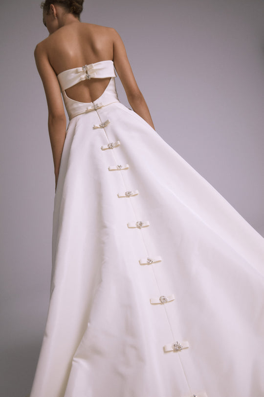 Tomlin, $6,995, dress from Collection Bridal by Amsale, Fabric: silk-faille